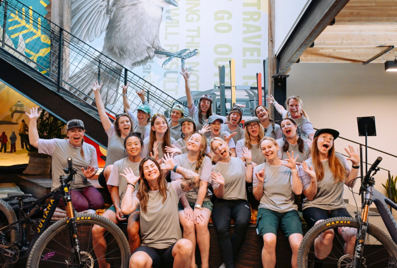 Staged group photo with women smiling and goofing off