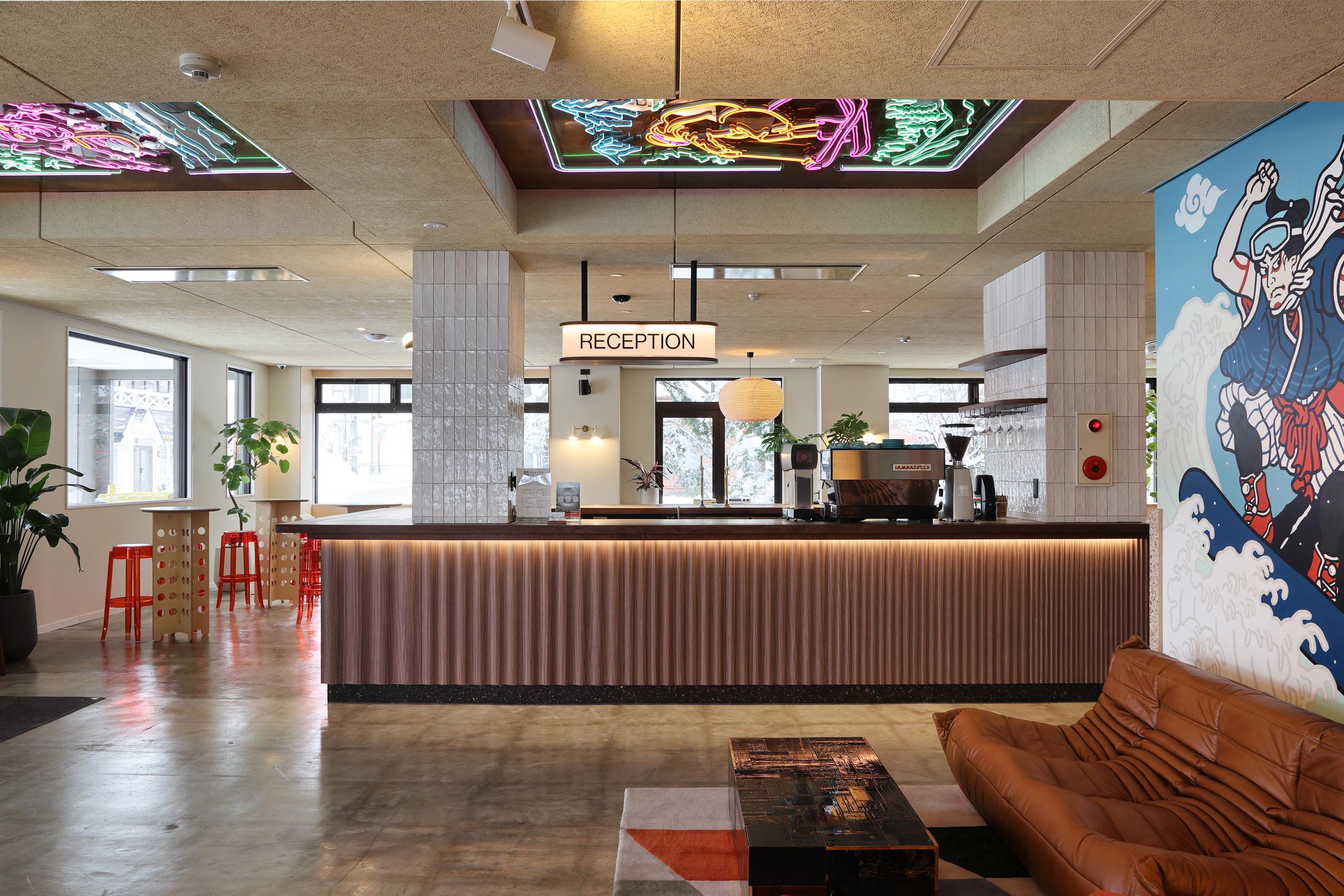 Hotel lobby with check in desk and lounge area